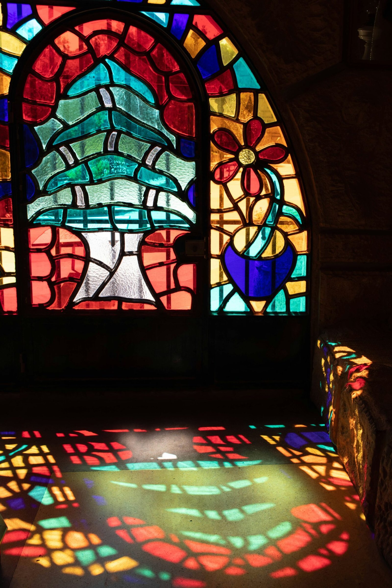 a stained glass window with a bright light coming through it